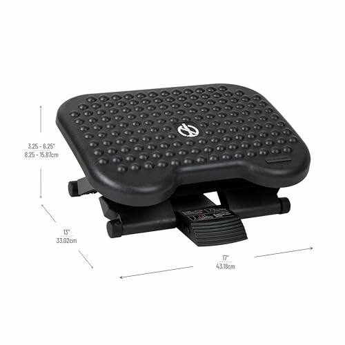 Black adjustable footrest with textured surface and dimensions.