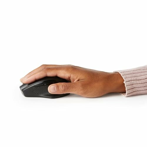Hand holding a black computer mouse