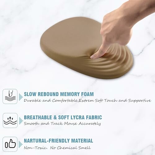 Hand pressing on slow rebound memory foam mouse pad.