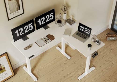 Minimalist desk setup with monitors, laptop, and decor items.