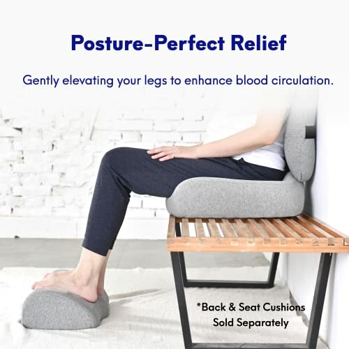 Person using cushions for posture to elevate legs and enhance circulation.